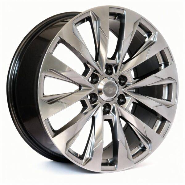 A close-up of a modern, metallic alloy car wheel rim with a sharp, multi-spoke design for the TOYOTA LAND CRUISER, shown against a white background.